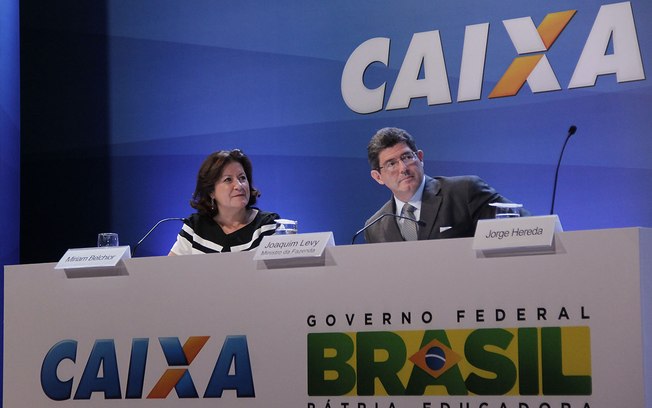 Miriam Belchior, presidente a Caixa, ao lado de Joaquim Levy, ministro da Fazenda