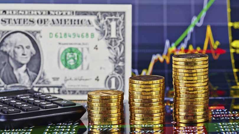 Moeda de ouro e dólar americano